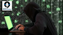 A hooded cybercriminal tries to hack into a website