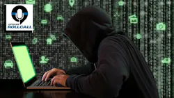 A hooded cybercriminal tries to hack into a website