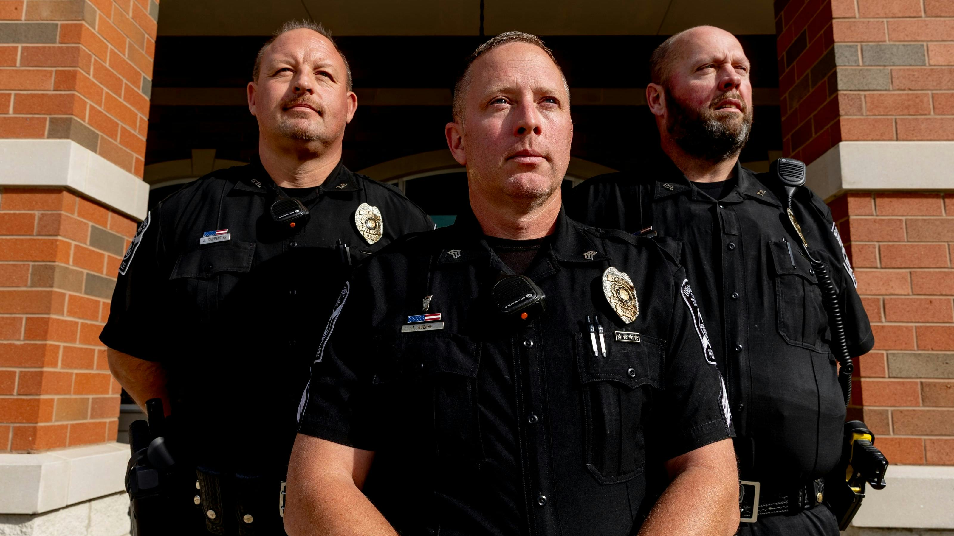 Grand Blanc Township Police Officer Jason Carpentier, Sgt. Tim Bueche and Officer Tom Whitt