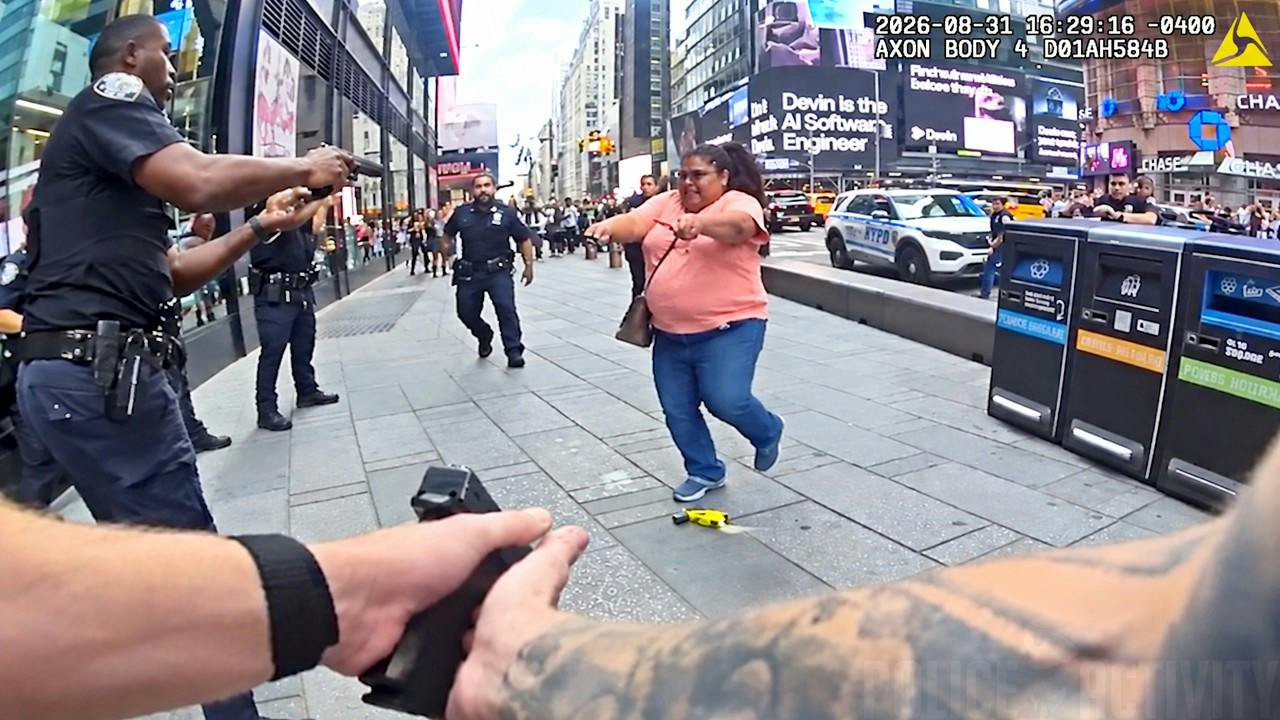 NYPD officers confront woman accused in deadly Times Square stabbing spree