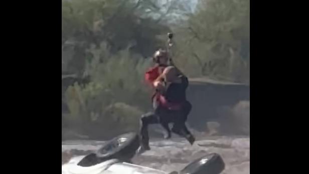 A Maricopa County deputy holds onto a sta