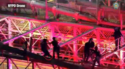 Drone footage shows NYPD officers talking with a knife-wielding man during a Sept. 4 Brooklyn Bridge encounter