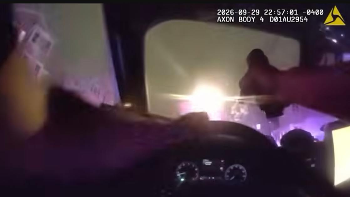 A West Hartford police officer shoots through his cruiser's windshield while pursuing a homicide suspect