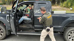 A deputy and a role player work through a vehicle-based training exercise