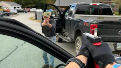 A deputy and a role player work through a vehicle-based, opposing-force exercise