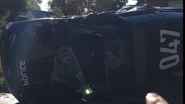 A Tulsa police cruiser flipped over after a stolen vehicle suspect T-boned it