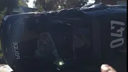A Tulsa police cruiser flipped over after a stolen vehicle suspect T-boned it