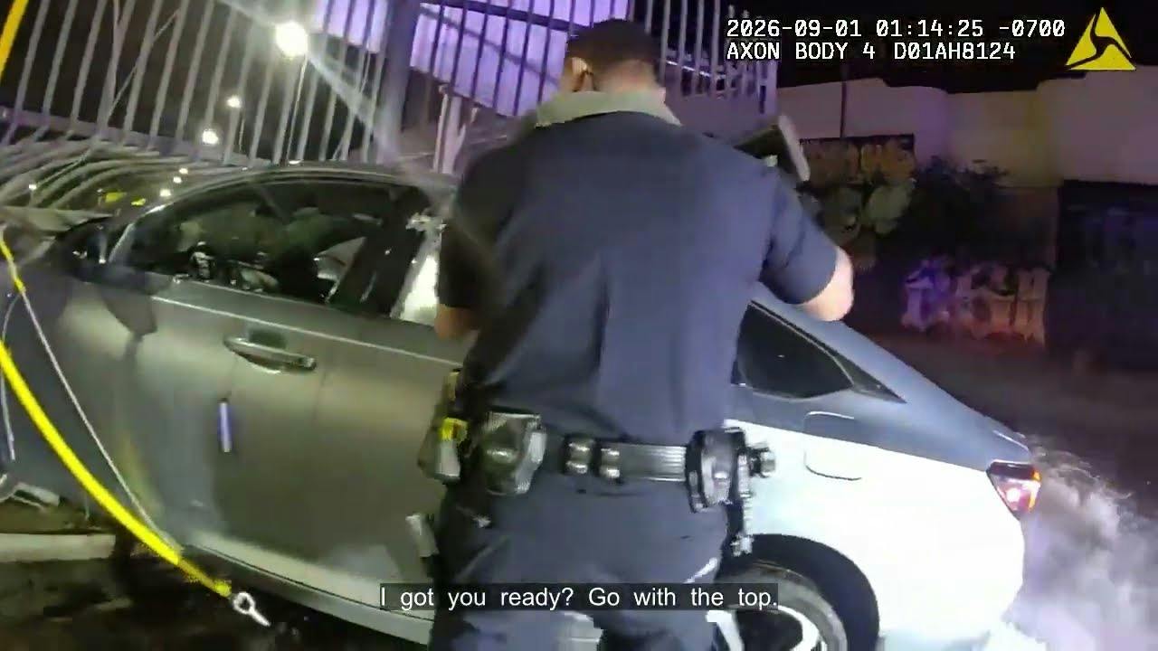 Long Beach police confront an armed suspect after a crash during a high-speed chase that ended in Los Angeles