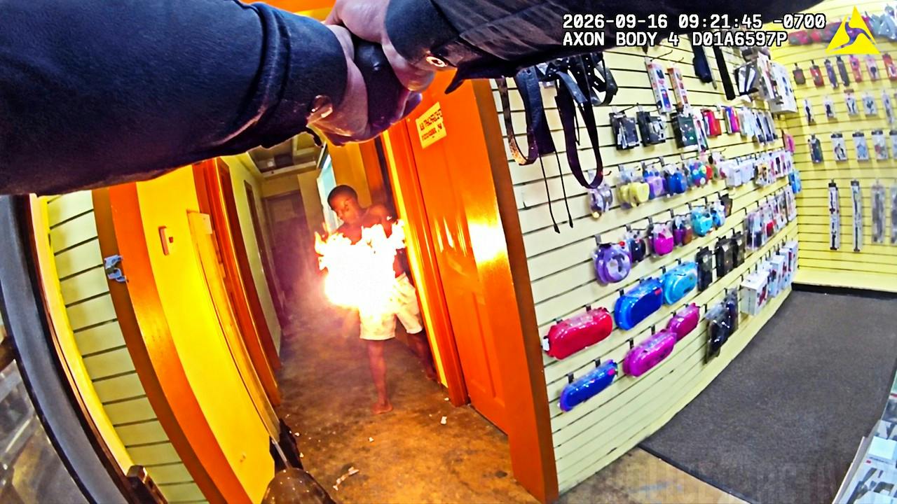 A suspect ignites an incendiary device and directs the flame at San Diego police