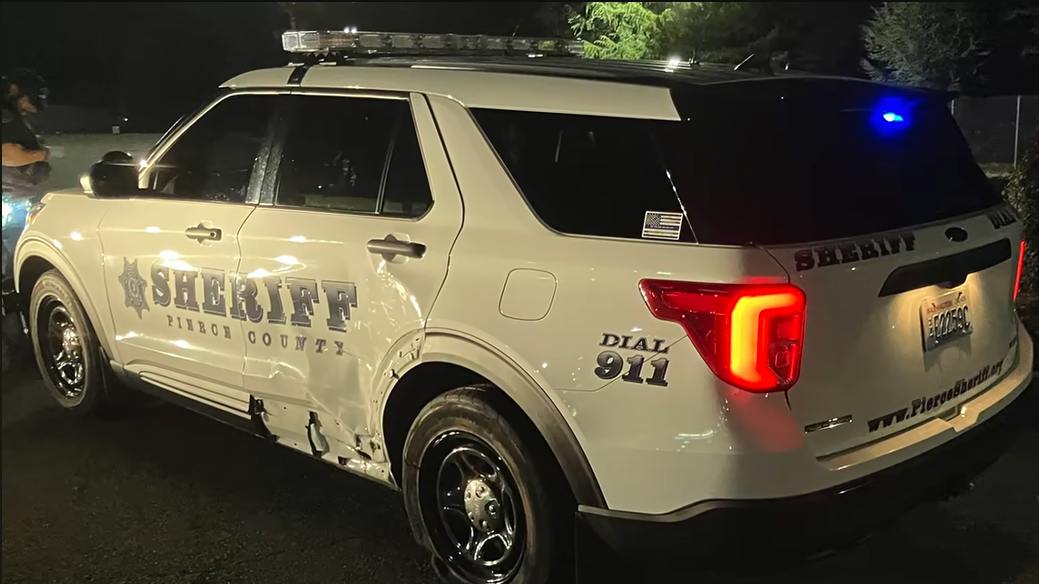 The damaged cruiser of a Pierce County Sheriff's Office sergeant who was struck in a hit-and-run crash with an SUV involved in a drive-by shooting