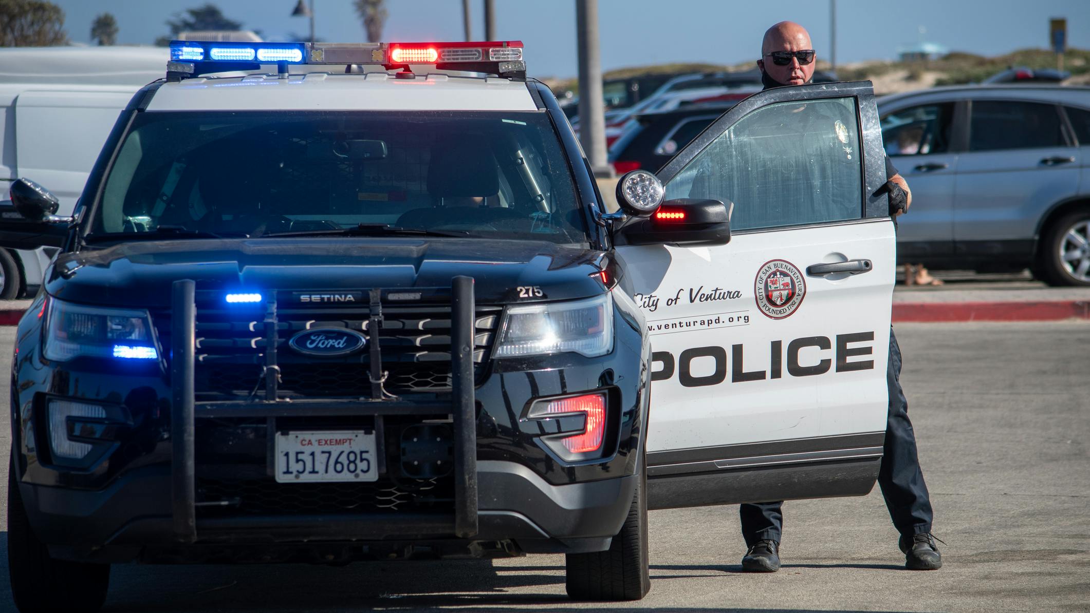 A Ventura police officer exits his SUV