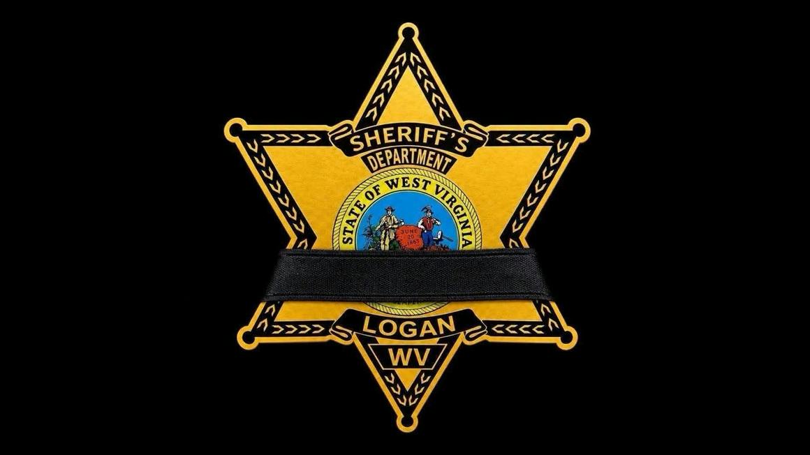 Logan County Sheriff's Office badge with black band over it