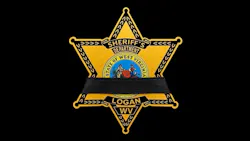 Logan County Sheriff's Office badge with black band over it