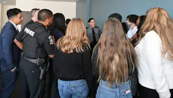 Students and law enforcement in role-playing scneario at the Chester County Youth and Law Enforcement Symposium