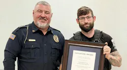 Cross City Police Sgt. Michael Henry (right) received a state lifesaving award from his chief, Jamey King