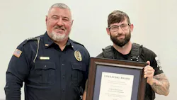 Cross City Police Sgt. Michael Henry (right) received a state lifesaving award from his chief, Jamey King