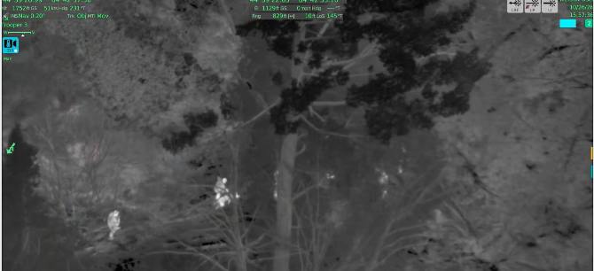Image from a Michigan State Police FLIR camera showing troopers converging on an escaped inmate