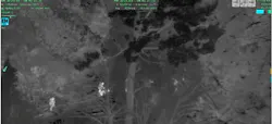 Image from a Michigan State Police FLIR camera showing troopers converging on an escaped inmate