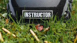 Firearms instructor's helmet among shell casings