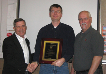Ron Helson, HCF Executive Director (left), presents the Hart Innovative Achievement Award to We Energies, represented by Todd Go
