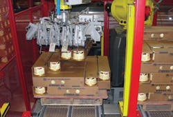 At Blue Bell Creamery, a robotic arm uses custom end-of-arm tooling including a gripper system to keep half-gallon containers in