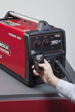 A mobile phone with a camera is being used to scan the 2D Microsoft Tag barcode on a Power MIG 180 to access information about t A mobile phone with a camera is being used to scan the 2D Microsoft Tag barcode on a Power MIG 180 to access information about t