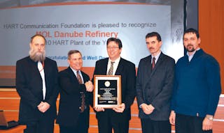G?bor Bereznai (holding plaque) and others from MOL Danube Refinery accepted the 2010 HART Plant of the Year award early this ye