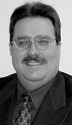 Al Hufstetler(shown here), UGS vice president of marketing, e-Factory, and Amir Livne, Tecnomatix executive vice president, mark Al Hufstetler(shown here), UGS vice president of marketing, e-Factory, and Amir Livne, Tecnomatix executive vice president, mark