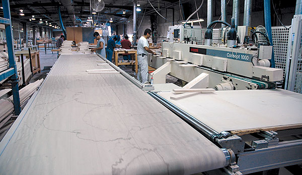 Customized machinery has helped Kent Moore Cabinets boost productivity by about 120 percent over the past 10 years.