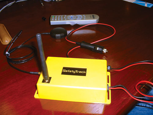 Fobs (top) worn by pipeline technicians and truck-mounted base units (left) are components of the Remote Reach system, says Dow'