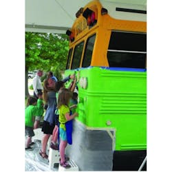 First graders at Mary Lin Elementary School (Atlanta, GA) paint the school bus being converted by Georgia Tech researchers and students into a hydraulic hybrid that runs on biofuel.
