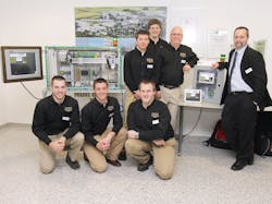 Purdue&apos;s Automated Assembly Team. Front: David Burroughs, Jason Wintz, Aaron Burns. Second row: Mike Harrington, Ryan Streu, Brad Harriger (team advisor) and Kelley VanBuskirk (Phoenix Contact mentor). Team members Derek Andrews and George Hinote are not pictured.