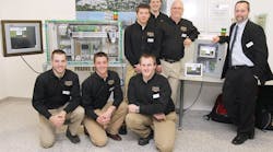 Purdue&apos;s Automated Assembly Team. Front: David Burroughs, Jason Wintz, Aaron Burns. Second row: Mike Harrington, Ryan Streu, Brad Harriger (team advisor) and Kelley VanBuskirk (Phoenix Contact mentor). Team members Derek Andrews and George Hinote are not pictured.