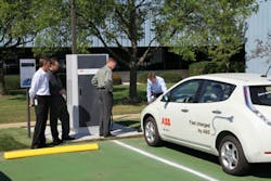 ABB&apos;s DC fast charger for electric vehicles &apos;tops-off&apos; an EV at ABB&rsquo;s office and production site in the industrial park in New Berlin, Wisc.