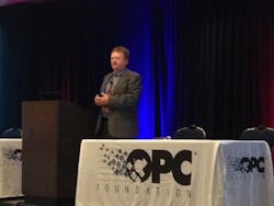 Tom Burke addressing attendees at OPC Technology Summit. Tom Burke addressing attendees at OPC Technology Summit.