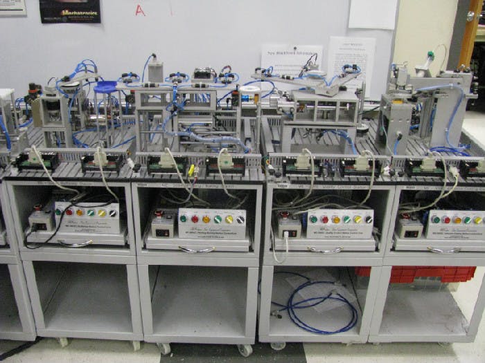 Four of the college&rsquo;s eight Sun Corp. automation trainers used in its MECH-54 course.