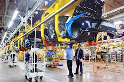 Chinese factory workers assemble Ford Focus cars on the assembly line at the auto plant of Changan Ford Mazda Nanjing Company in Chongqing.