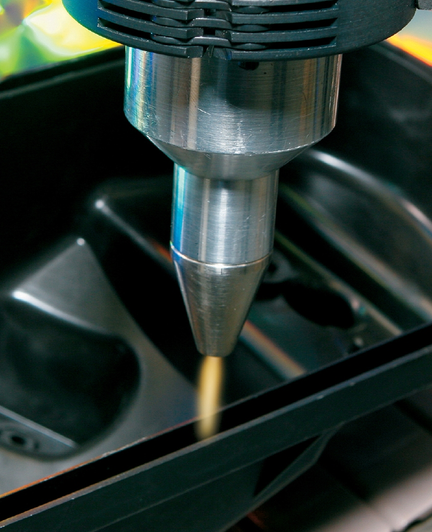 Flame treatment readies an auto dashboard for adhesive. Source: Enercon