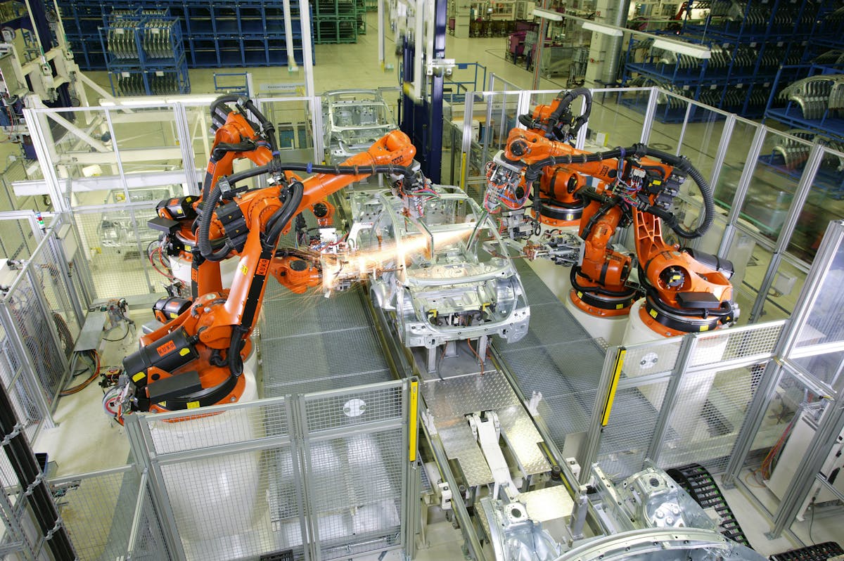 Kuka Robots perform spot welding.