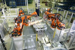 Kuka Robots perform spot welding.