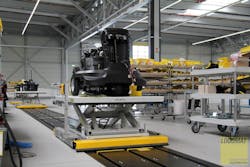 Assembly line with a height adjustable, self-driven electrical E-Cart.