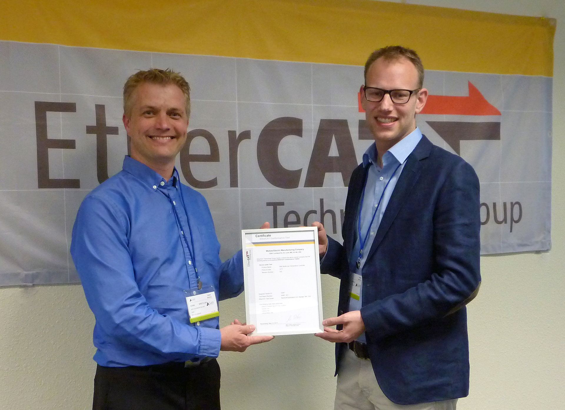 ETG representative Florian H&auml;fele (right) awarded the first official North American conformance certificate to Watlow's Stan Breitlow.