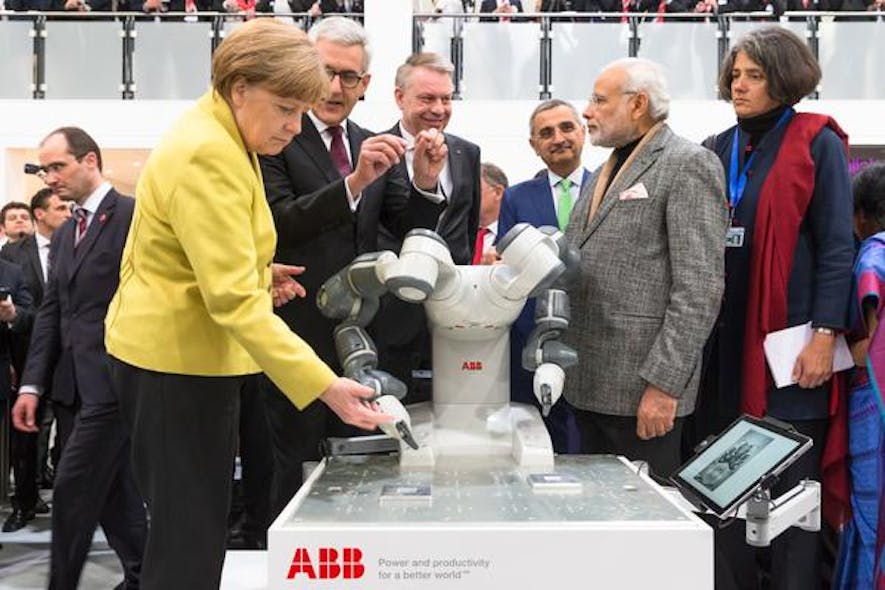 ABB CEO Ulrich Spiesshofer shows YuMi to German Chancellor Angela Merkel and Indian Prime Minister Narendra Modi at Hannover Messe in Germany.