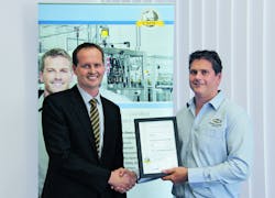 Congratulations: In Sydney, Australia Electrical engineer Rod Burton (right) from Machinery Automation &amp; Robotics, receives the