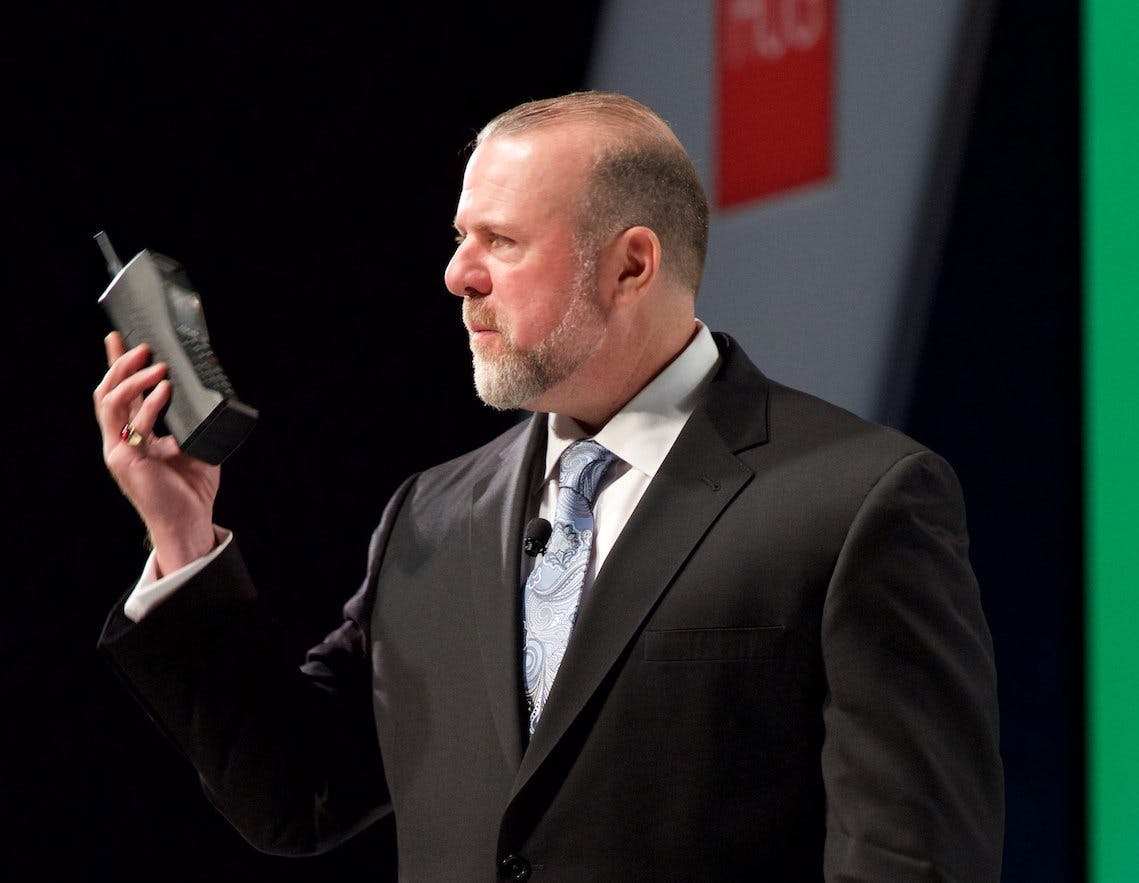 Honeywell&apos;s Andy D&apos;Amelio holds a 40-year-old mobile phone to make a point about 40-year-old control systems.
