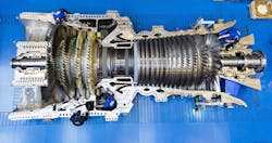 GE workers in Belfort, France, assemble the record-breaking 9HA gas turbine for EDF’s plant in Bouchain, France. Source: GE Power GE workers in Belfort, France, assemble the record-breaking 9HA gas turbine for EDF’s plant in Bouchain, France. Source: GE Power