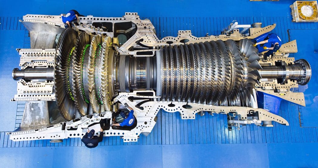 GE workers in Belfort, France, assemble the record-breaking 9HA gas turbine for EDF&rsquo;s plant in Bouchain, France. Source: GE Power