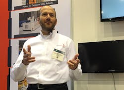 Greg Giles, RedViking&rsquo;s director of MES and error proofing systems, briefs press members during IMTS about the Argonaut platform.