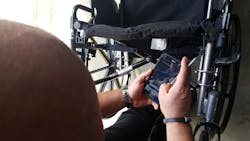 A home care technician uses scan feature. A home care technician uses scan feature.