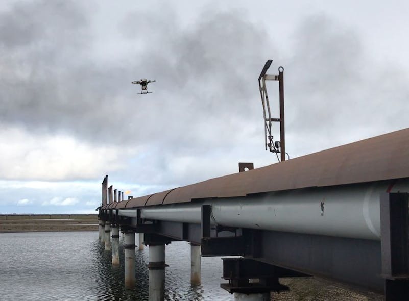 A drone flies over in-service flare stacks, identifying corrosion and marking the locations for maintenance.